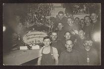 Group of soldiers standing around a Christmas tree